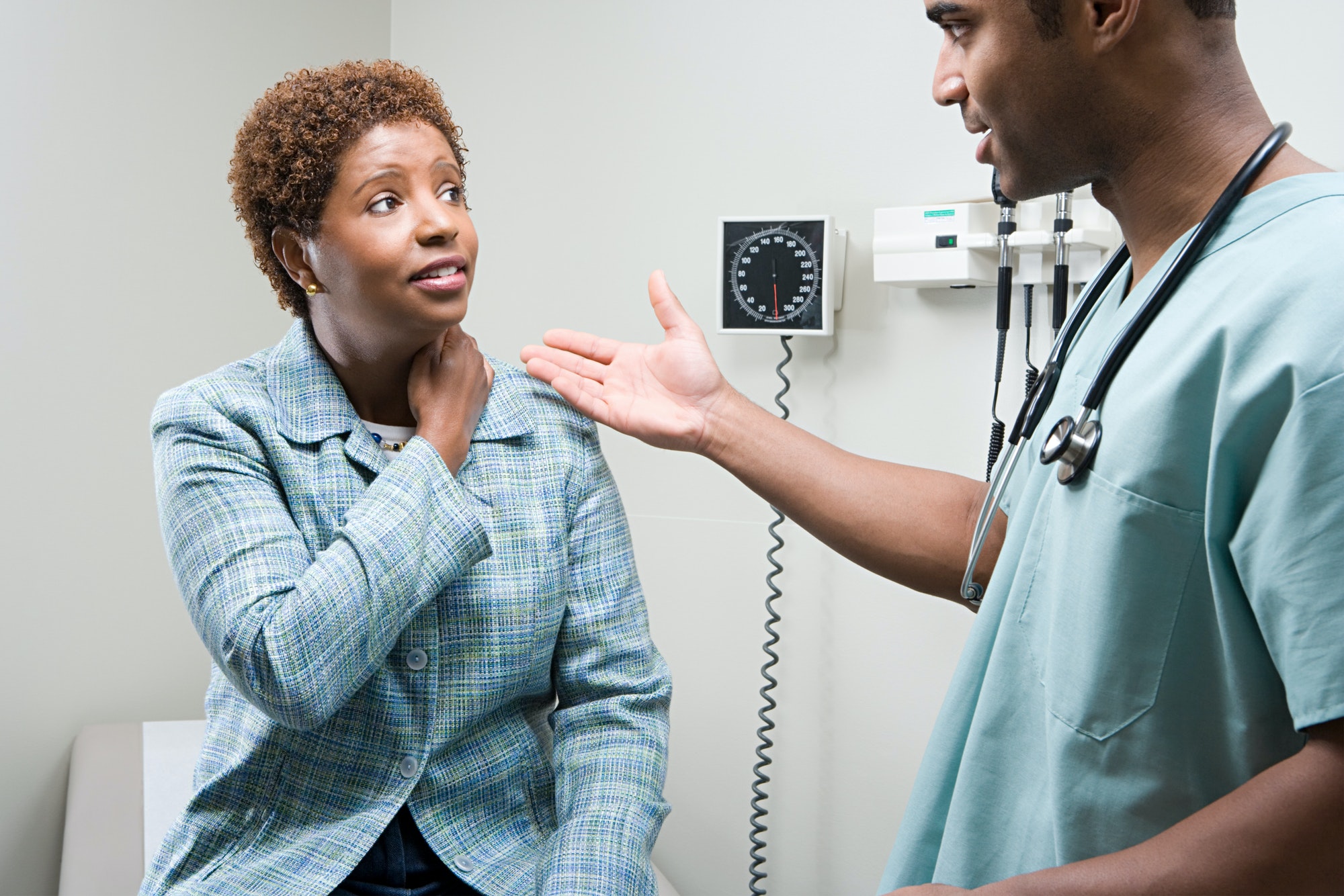 Woman talking to doctor